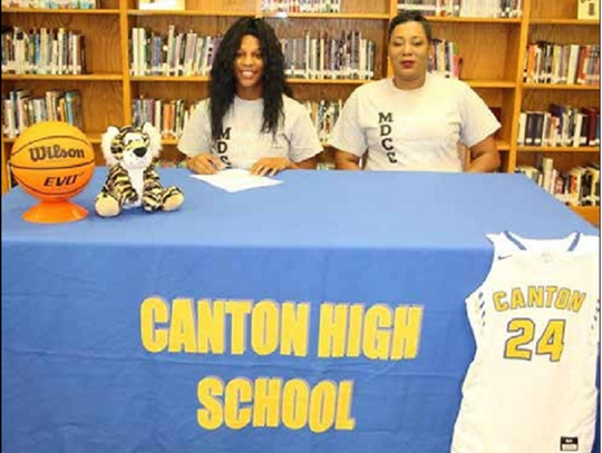 Canton High School students sign college scholarships