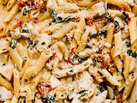 This delicious, easy-to-make dish filled with chicken, pasta, tomatoes, spinach and cheese is the perfect make-ahead dish to throw in the cooler and take to the beach for reheating for a quick meal.