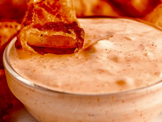 A copycat version of the famous Blooming Onion Sauce also doubles as a delicious dip for onion rings, fries and chips.