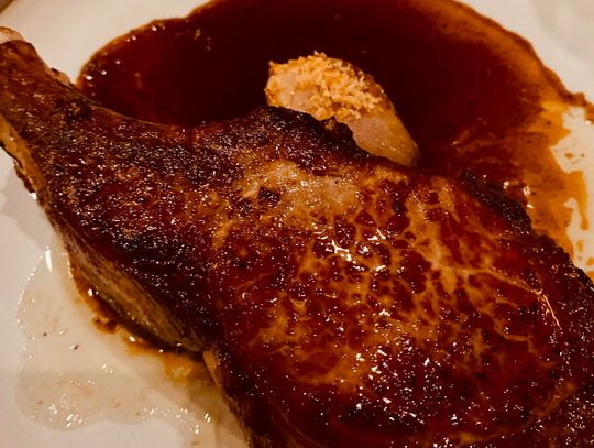 The Switchback at Cataloochee Ranch in Maggie Valley, NC, serves a pork chop that is hearty and delicious enough to be served alone. However, it pairs nicely with seasonal vegetables.