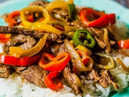 Pepper Steak over Rice is light enough for a summer meal and can cook in the Crockpot during the day, getting dinner on the table in no time.