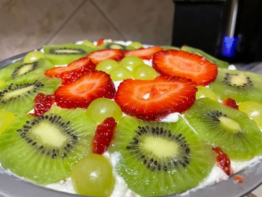 on the table:  Fruit Pizza  