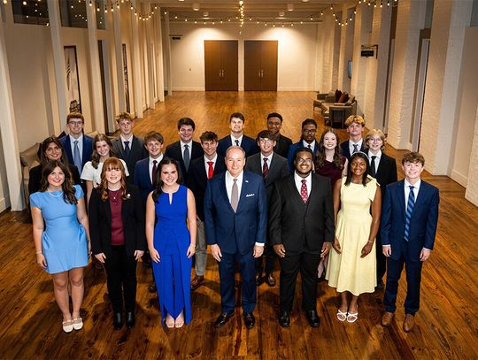 The 2026-27 Mississippi State University Presidential Scholars and President Mark Keenum stand in three rows in a large hall