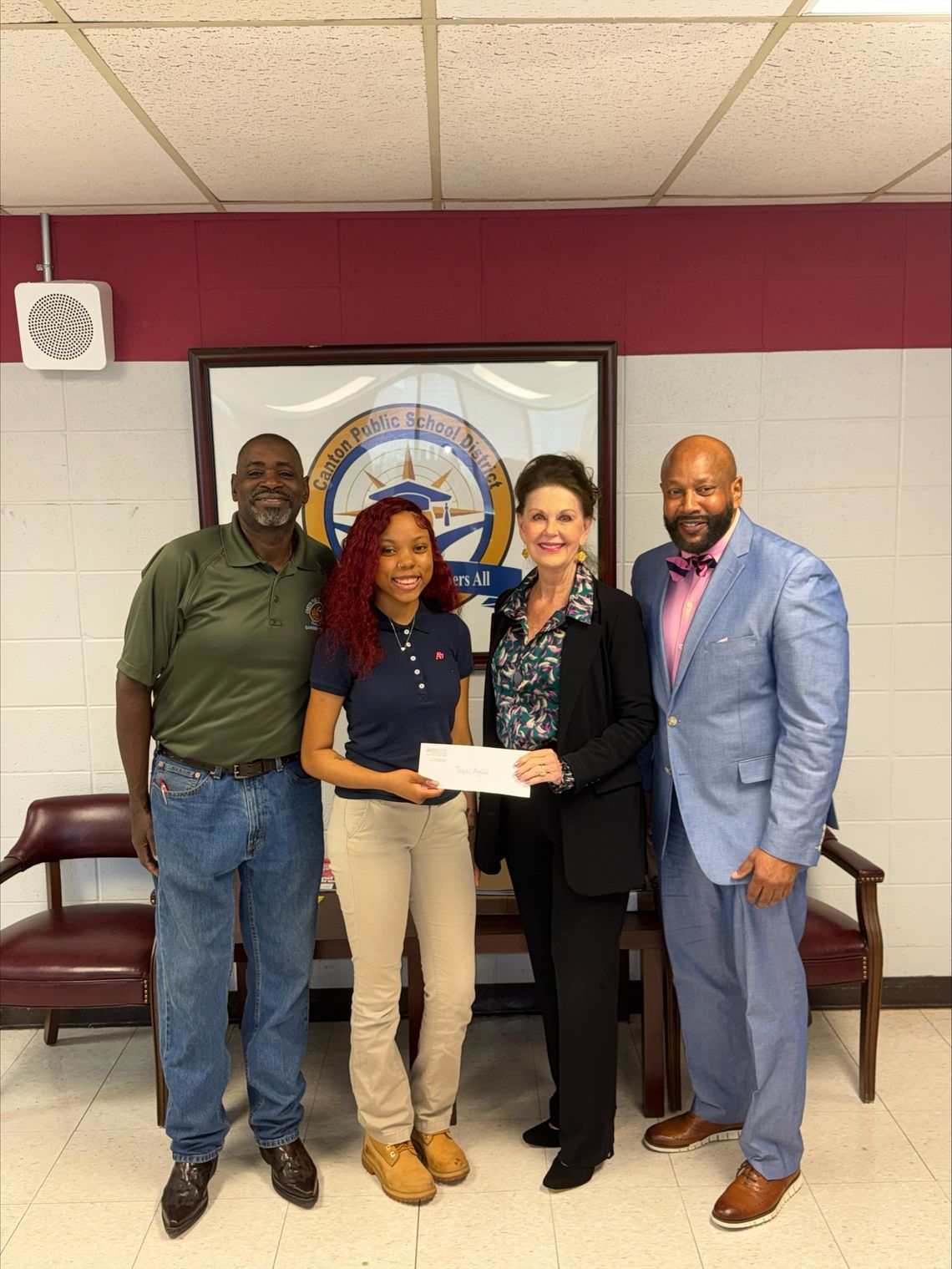 Pictured (l–r): Wayne Day, Collision Repair Instructor at CCC; Trenice Mayfield, Student at CCC; Jan Collins, MCBL&F; and Michael Ellis, Director at CCC.