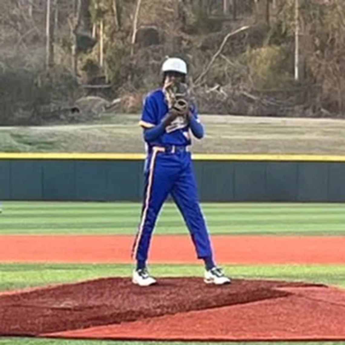 Canton high School Baseball Begins with Back to back Victories canton baseball player looks over glove