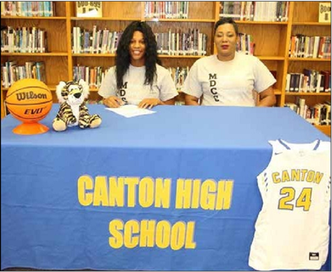 Canton High School students sign college scholarships