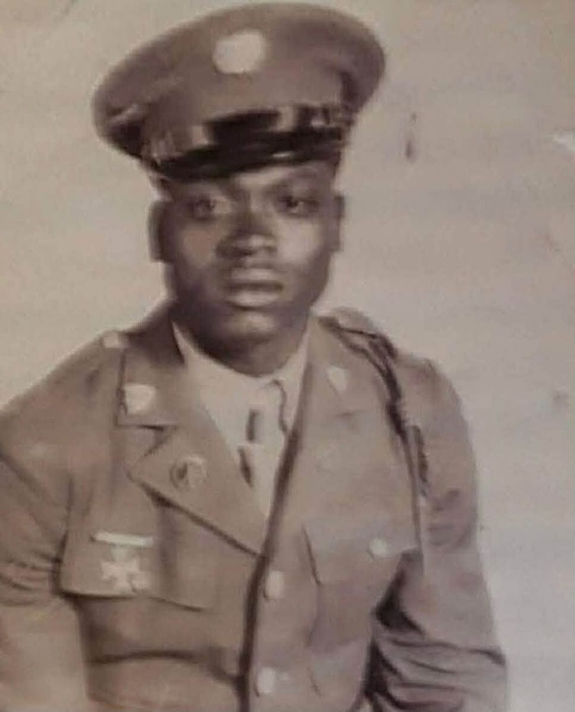 Canton veteran John Wesley Henry celebrates 107th birthday Black-and-white portrait of a young man in a military uniform and cap
