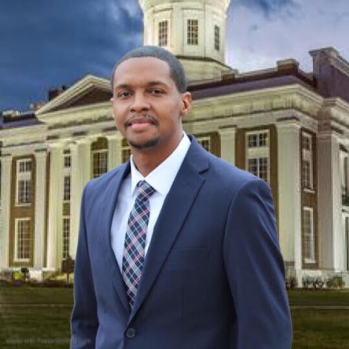 Jonathan Dixon named new CMU commissioner A man in a dark suit and tie smiles at the camera