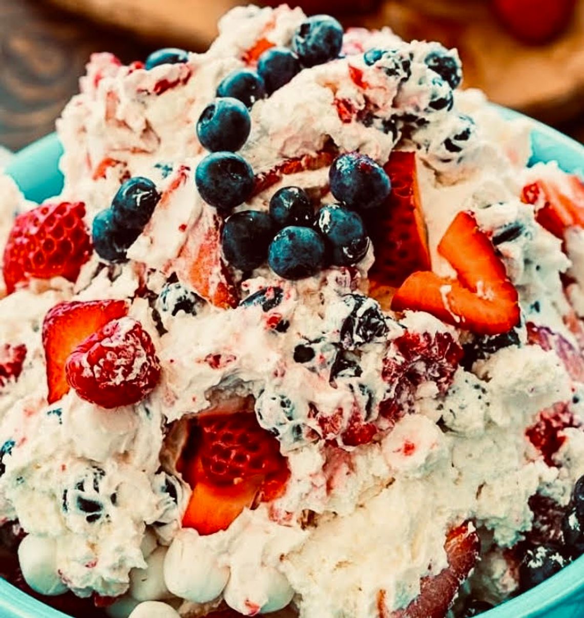 Berry Patriotic Cheesecake Fluff Salad is the easiest possible dessert to make for a Fourth of July gathering, but you wouldn’t know that from the creamy, delicious taste.