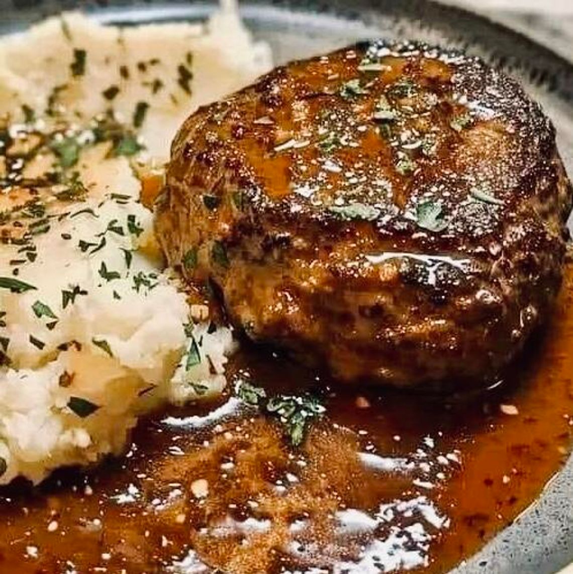 There’s no better comfort food than Salisbury steak served with a side of mashed potatoes and gravy.