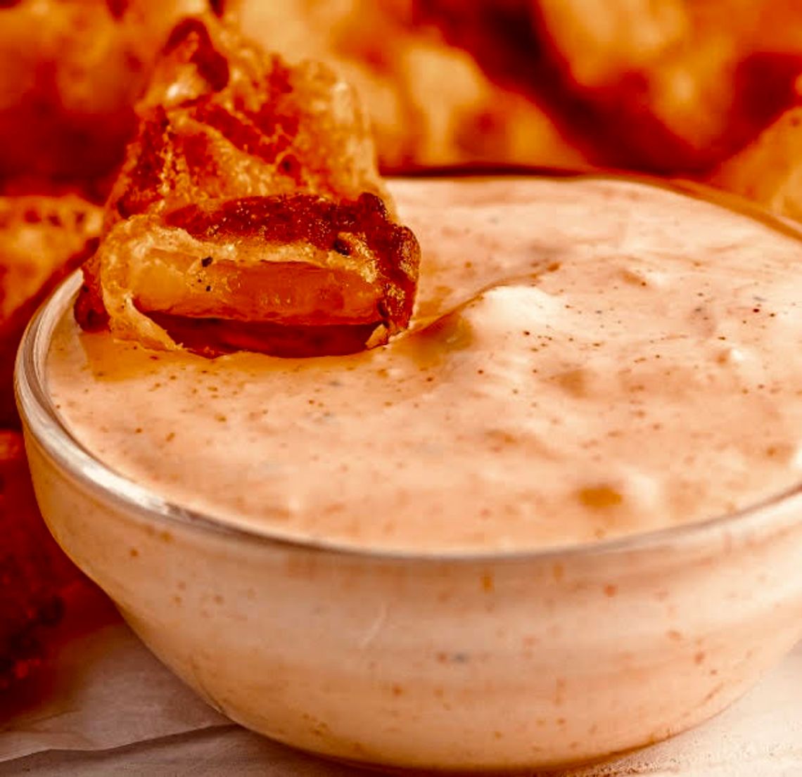 A copycat version of the famous Blooming Onion Sauce also doubles as a delicious dip for onion rings, fries and chips.