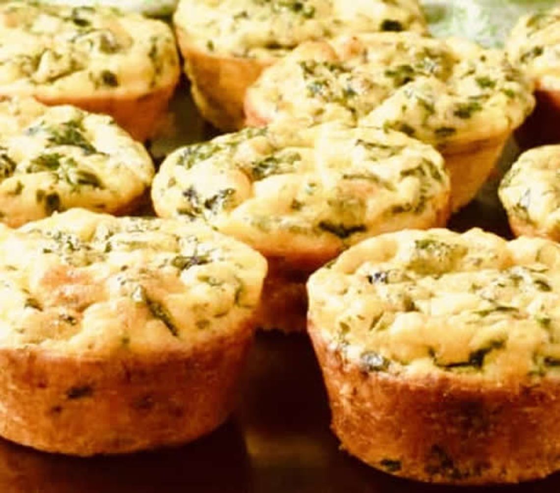 Hearty egg muffins filled with spinach and cheese (or favorite protein like bacon or ham) are easy to eat on the go and are a healthy breakfast option.