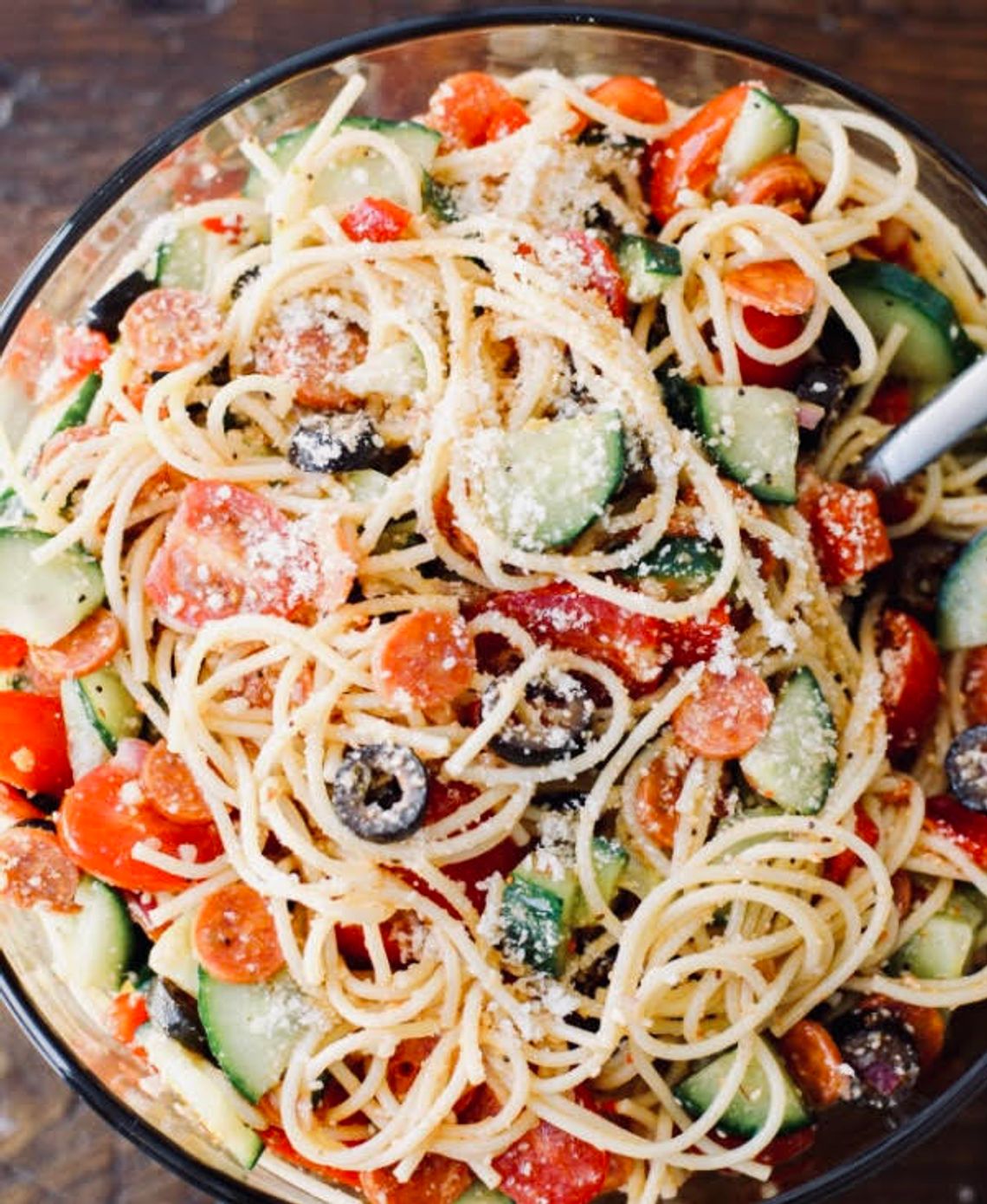 Spaghetti salad, full of chopped vegetables and tangy dressing, is the perfect hot-weather meal or side dish.