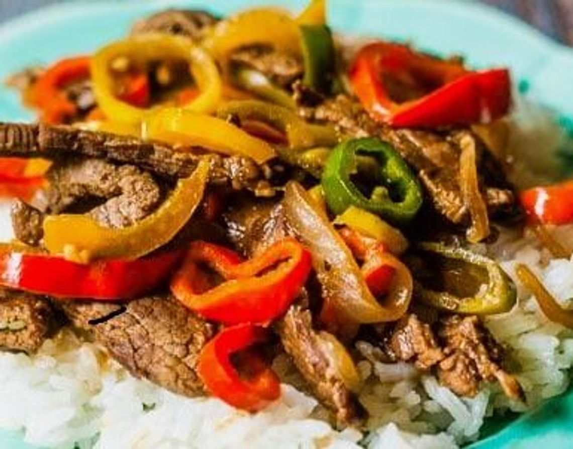 Pepper Steak over Rice is light enough for a summer meal and can cook in the Crockpot during the day, getting dinner on the table in no time.