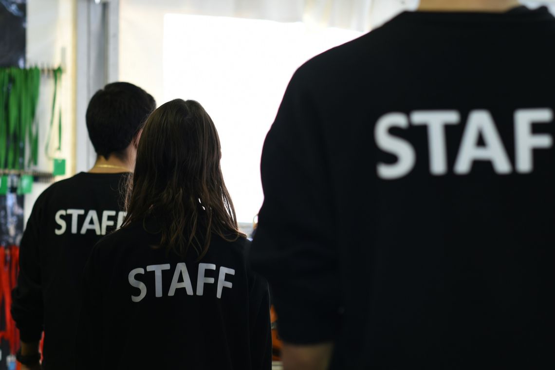 Why Every Event Needs a Strong Emergency Plan group of people in black staff shirts standing in a room